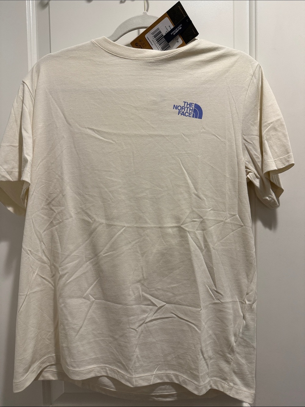 NWT The North Face Women’s Short Sleeve Tee in Cream with Blue Logo